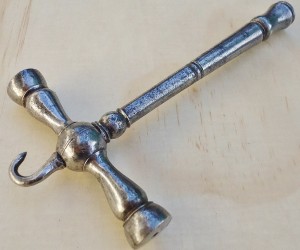 Early tuning hammer with stringing hook.