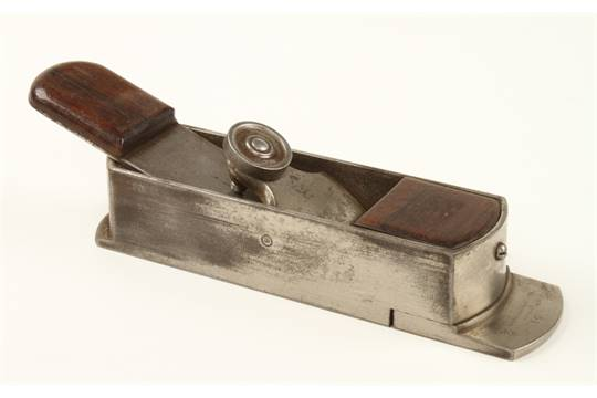 J. Erlandsen plane with rounded step instead of triangular. Front sole is machined at an angle, and lever cap screw is iron or steel. Photo from David Stanley Auctions.