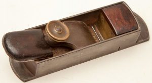Here is a specific example of Brandt's and Thorested's influence on N. Erlandsen. This small 7 1/4" N. Erlandsen mitre plane has a brass plate at the back of the front infill, instead of the typical convex rosewood moulding. The brass plate was introduced by Brandt, and used by Thorested as well. It made making the infill easier and faster, and in the case of Erlandsen mitres, gave more space to Erlandsen's escapement, which has less room than other mitres because of the convex moulding. This is especially true with the smaller Erlandsen mitres such as H.S. no. 13b shown earlier on this page.