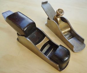 Two Buck thumb planes, both made by Norris. In the foreground is no. 32, and in the background is no. 31. 
